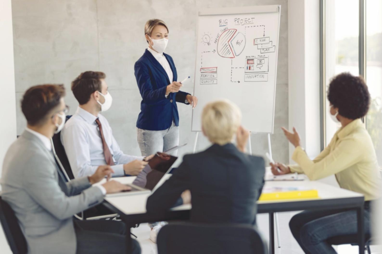 Close-up view of financial analysis worksheets with calculators and data charts